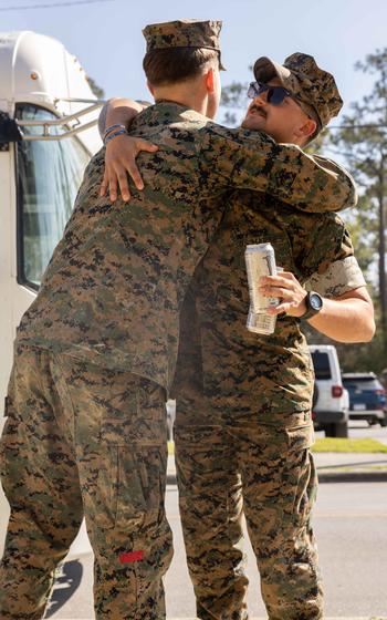 A U.S. Marine with Combat Logistics Battalion 22, 26th Marine Expeditionary Unit (Special Operations Capable) (MEU(SOC)) reunites with his friend at Camp Lejeune, N.C., Sunday, March 17, 2024.