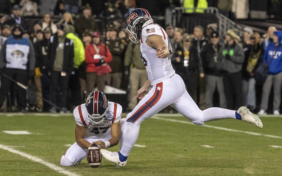 Navy Midshipmen kicker Bijan Nichols kicks an extra point to tie the score at 17 during overtime play in the 123rd Army-Navy football game played at Philadelphia's Lincoln Financial Field on Saturday, Dec. 10, 2022. Army went on to win the game 20-17 in double overtime.