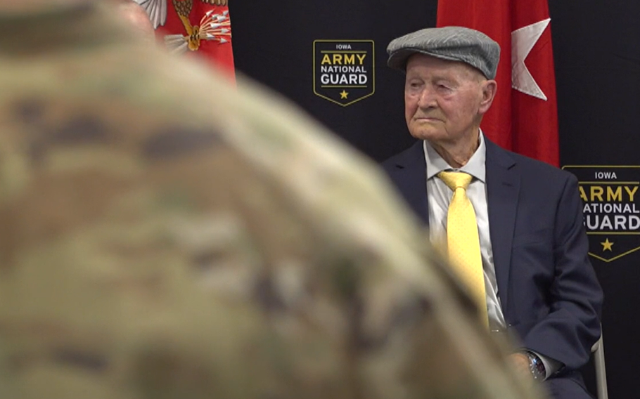 An elderly man looks to the side