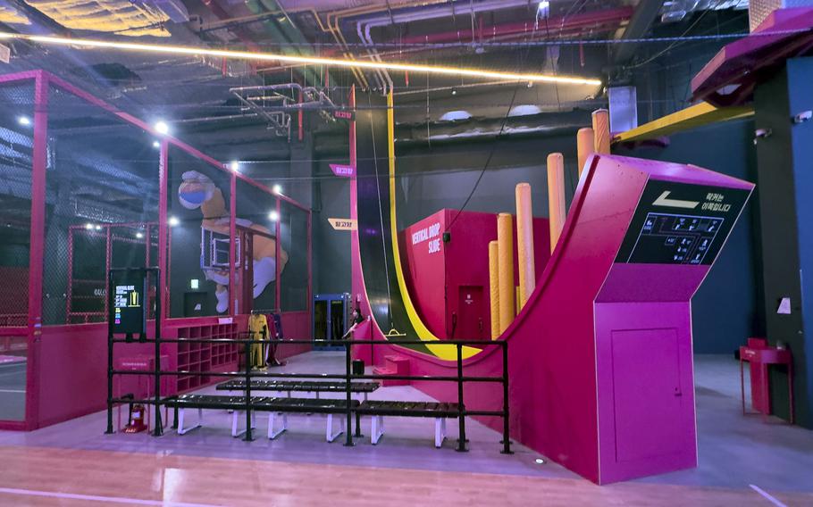 A huge, brightly colored vertical drop slide.