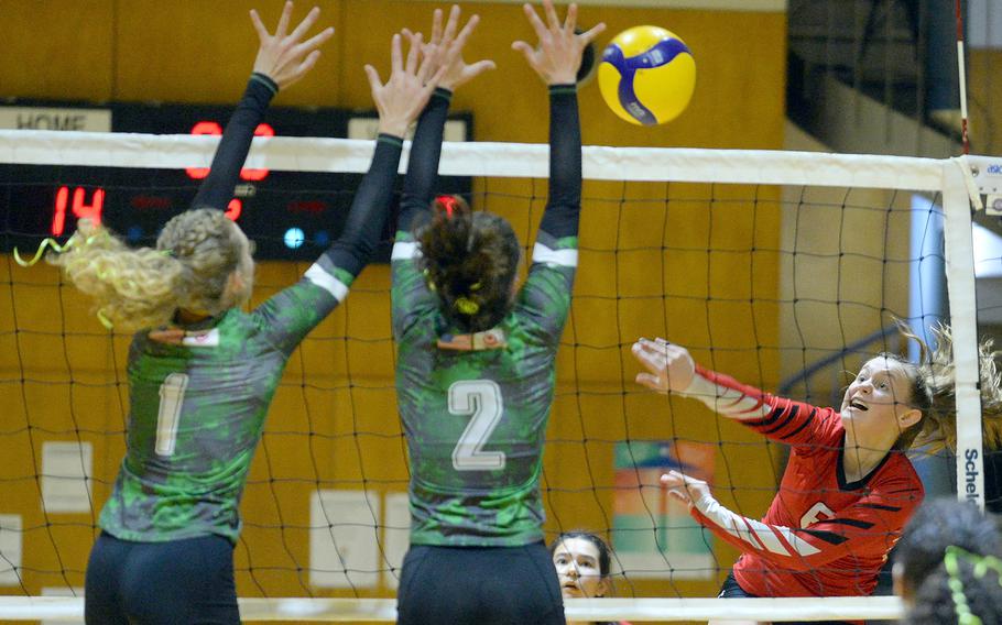 E.J. King's Madylyn O'Neill spikes against Kubasaki's Emma Leggio and Grace Berrens during Saturday's YUJO tournament semifinal. The Dragons won in two sets and went on to win the championshp. The Cobras went on to finish third.