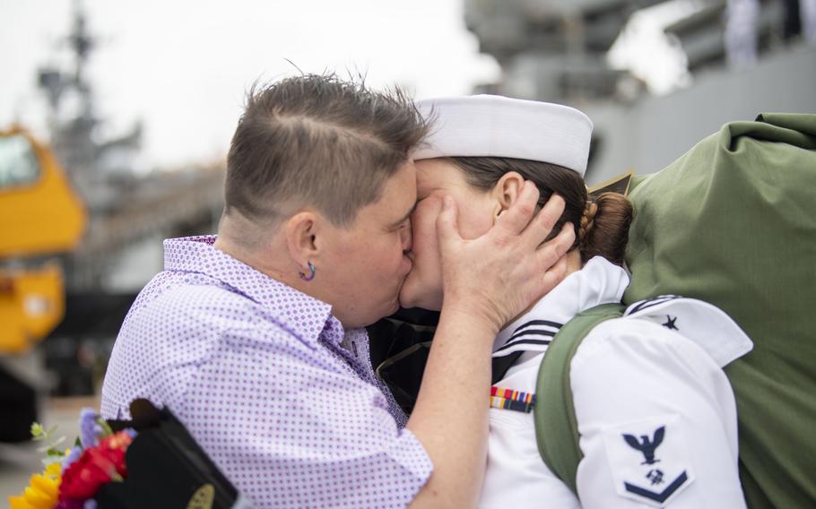 A sailor kisses a loved one