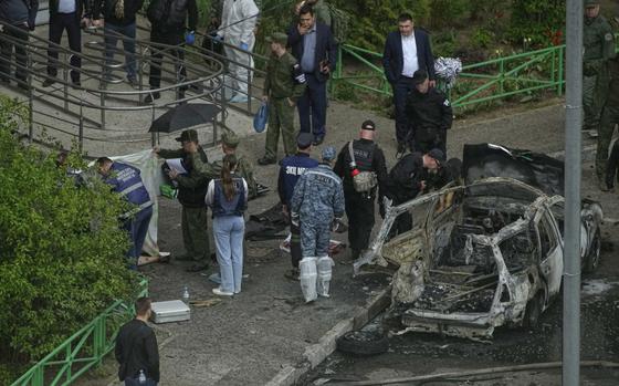Investigators work at the scene where Lt. Gen. Yaroslav Moskalik, a deputy head of the main operational department in the General Staff of the Russian armed forces, was killed by an explosive device placed in his car in Balashikha, just outside Moscow, Russia, on Friday, April 25, 2025. (AP Photo)