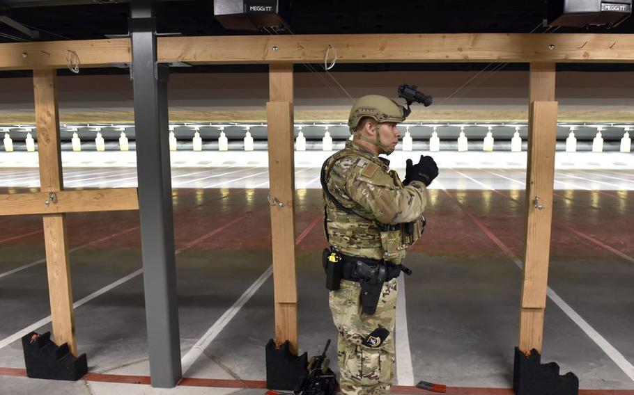 Tech Sgt. Bobby Trevino gives a demonstration of the new Small-Arms Indoor range at Westover Air Reserve Base. Officials held a ribbon cutting ceremony for the new facility.