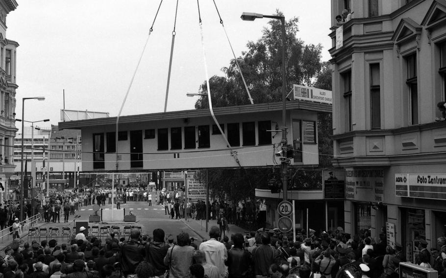 Checkpoint Charlie is lifted off its spot June 22, 1990, in Berlin. The checkpoint shack is now in the Allied Museum in the Dahlem neighborhood of Berlin. 