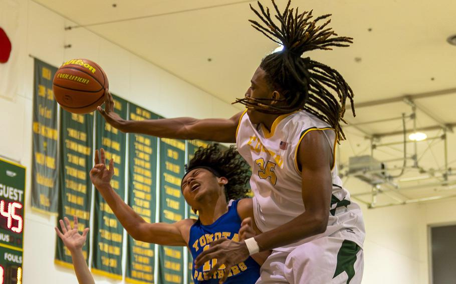 Robert D. Edgren's Je'Shawn Spaights-Pace slaps the ball away from Yokota's Royce Canta during Friday's DODEA-Japan boys basketball game. The Panthers won 67-57.