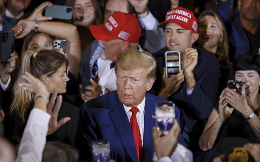 Former president Donald Trump greets supporters at his Mar-a-Lago property in Palm Beach, Fla., on April 4, 2023. 