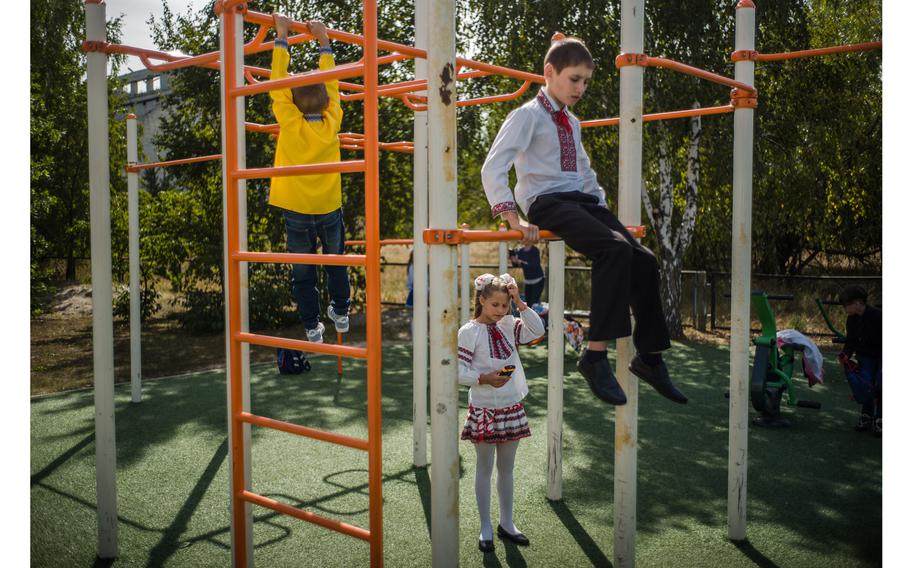 Children on a playground in front of the school in Nove Zalissya. 