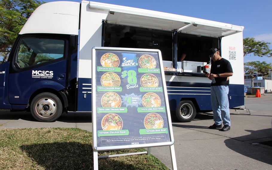 Lance Cpl. Bernardino Simbolon, an administrator at the Installation Personnel Administration Center, waits for lunch outside the Chef Shack food truck at Camp Foster, Okinawa, Nov. 29, 2023.