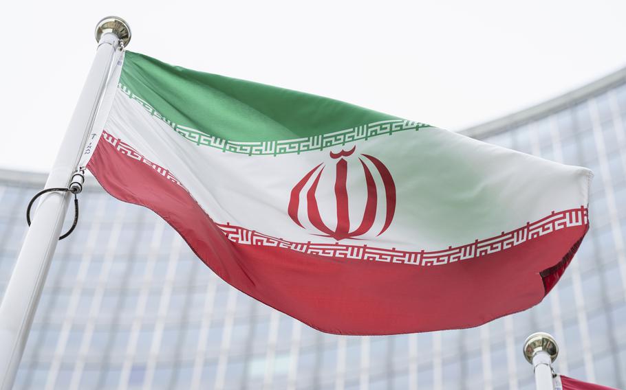 The flag of Iran waves in front of the the International Center building with the headquarters of the International Atomic Energy Agency, IAEA, in Vienna, Austria, May 24, 2021.