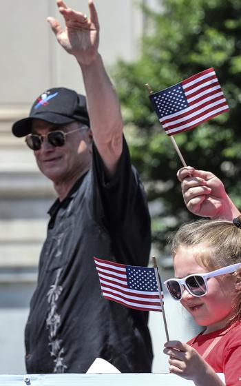Actor Gary Sinise waves to the crowd during the National Memorial Day Parade in Washington, D.C., May 30, 2022.