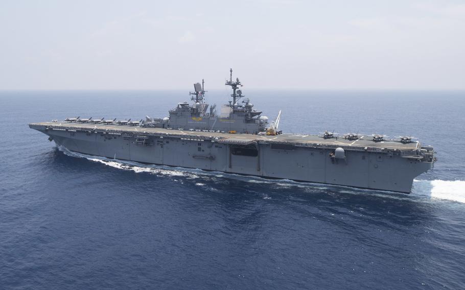 The amphibious assault ship USS Tripoli sails in the Philippine Sea, May 24, 2022, after departing Marine Corps Air Station Iwakuni, Japan.