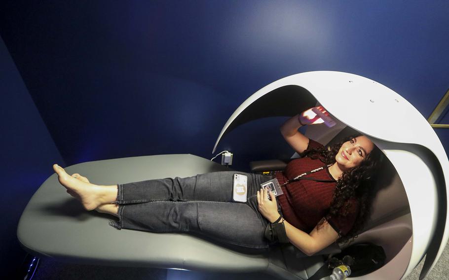 Times reporter Gabrielle Calise prepares to rest at the Nap Pod in Tampa, Fla.
