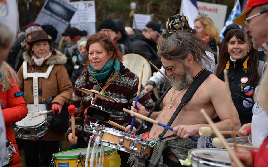 A group of drummers perform a freestyle drumming circle during an anti-war protest near Ramstein Air Base, Germany, on Feb. 26, 2023. Police estímates nearly 2,500 people attended the demonstration.