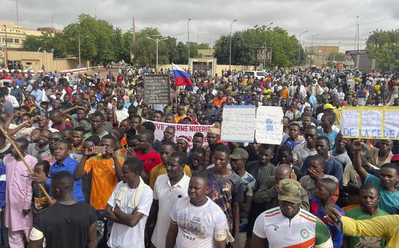 Supporters of Niger's ruling junta gather for a protest in Niamey, Niger, in August 2023.