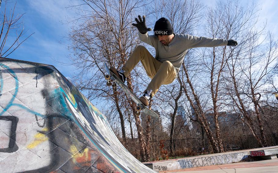 Merza Mohammadi, who was evacuated from Afghanistan amid the Taliban takeover in August, flashes across a quarter pipe at Paine’s Park in Philadelphia on Jan. 14, 2022.