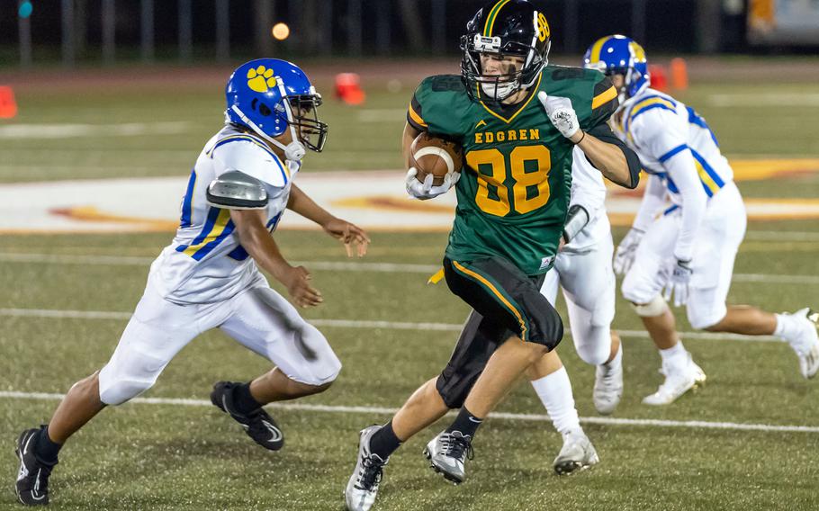 Robert D. Edgren's Gabriel Simmons tries to outrun three Yokota defenders.