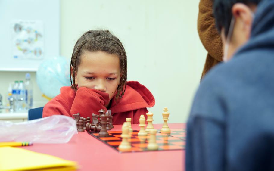 Mekhi Harvey, a fifth-grader at Shirley Lanham Elementary School, plays chess against a local Japanese student during a tournament at Naval Air Facility Atsugi, Japan, Feb. 23, 2024. 