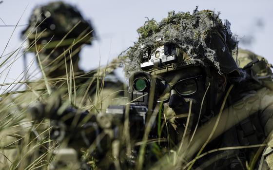U.S. Army Pfc. Brandon Horvath, a machine gunner with the 1st Infantry Brigade Combat Team, holds a fighting position during an exercise at Camp Adazi, Latvia, on Sept. 16, 2023. The 101st Airborne Division's 3rd Infantry Brigade Combat Team will deploy 3,400 soldiers to Europe to replace the 1st Infantry Brigade Combat Team.