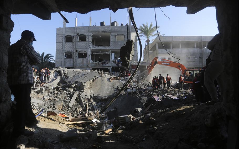 Palestinians search for survivors outside a morgue in Rafah after the Israeli bombardment of the Gaza Strip on Dec. 19.