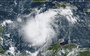 This satellite image provided by the National Oceanic and Atmospheric Administration shows Tropical Storm Ian over the central Caribbean on Saturday, Sept. 24, 2022.