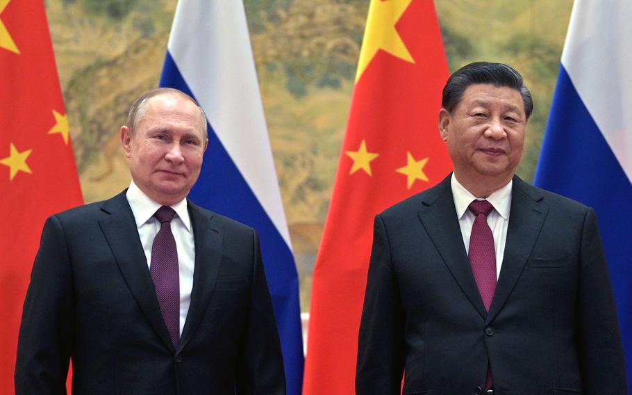 Chinese President Xi Jinping, right, and Russian President Vladimir Putin pose for a photo prior to their talks in Beijing, China, Friday, Feb. 4, 2022. Putin on Friday arrived in Beijing for the opening of the Winter Olympic Games and talks with his Chinese counterpart Xi Jinping, as the two leaders look to project themselves as a counterweight to the U.S. and its allies.