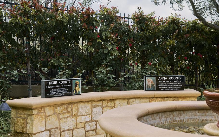 Commemorative plaques of Dean Koontz’s beloved deceased golden retrievers in the backyard. Their ashes reside in urns in the couple’s bedroom. Koontz and his wife Gerda hope that, when their time comes, their ashes will be buried with them. 