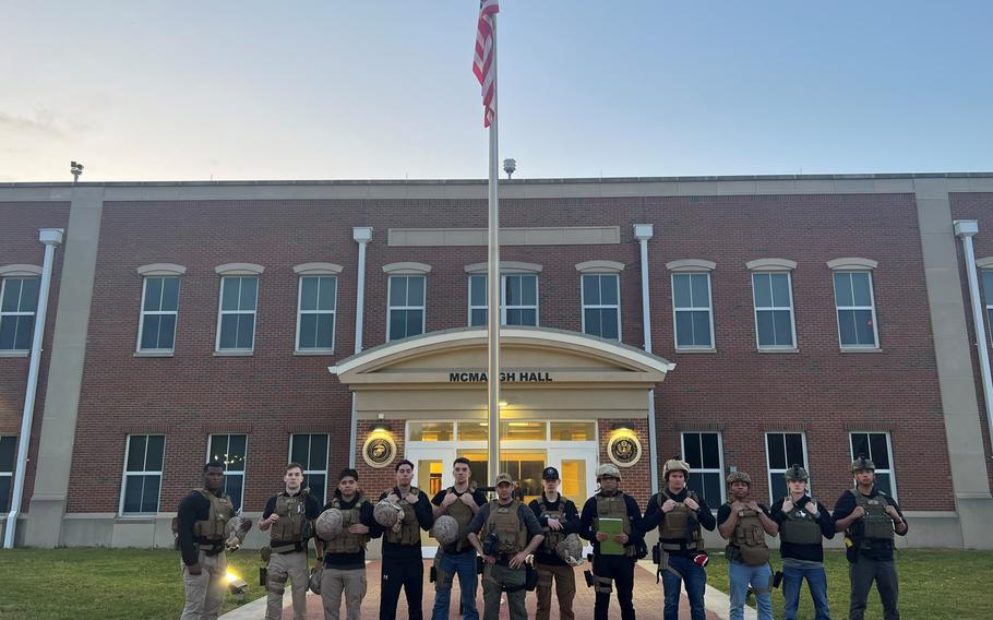 The Marine Security Guard Detachment assigned to the U.S. Embassy in Khartoum, Sudan, stands for a photo in front of McMaugh Hall at Marine Corps Base Quantico, Va., on April 24, 2023.
