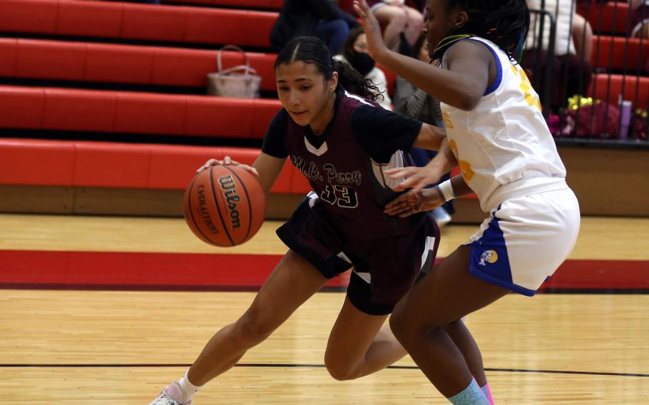 Naiya Burford dribbles.