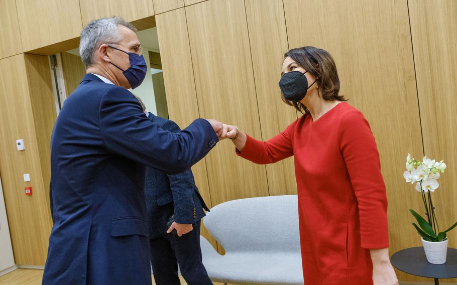 NATO Secretary General Jens Stoltenberg greets the new German Foreign Minister Annalena Baerbock at NATO Headquarters in Brussels, Belgium, Dec. 9, 2021. The visit was part of the first official trip abroad for the new minister, who is visiting officials in Paris, Brussels and Warsaw after taking office Wednesday.