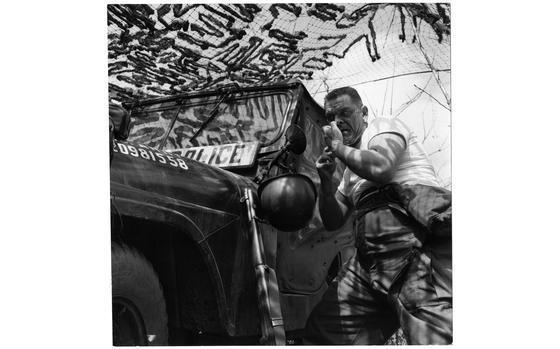 Somewhere in South Korea, April 1958: Using his jeep's side mirror and his helmet as a basin, Spc. Harry W. Wise shaves after a night of guard duty. Wise and his 7th Military Police Company (Prov.) was on a five-day field exercise with the 7th Infantry Division. The Army's first pentomic MP company pulled guard duty and local road patrols not in the regular 7th Inf. Div.'s area, but in the battle-scarred mountains of north-central South Korea, where field exercise Northwind was held. 
The short lived pentomic structure adopted by the U.S. Army between 1957 and 1963 aimed at creating units able to deploy more rapidly than the traditional brigades by combining parts of different units in one comprehensive and cohesive unit, reducing the time needed to organize an attack if different brigades were involved. With nuclear arms entering the battlefield after WWII, the pentomic units would be able to respond quickly before the enemy could respond with a nuclear strike.  

Looking for Stars and Stripes’ historic coverage? Subscribe to Stars and Stripes’ historic newspaper archive! We have digitized our 1948-1999 European and Pacific editions, as well as several of our WWII editions and made them available online through https://starsandstripes.newspaperarchive.com/

META TAGS: Pacific; South Korea; 7th Infantry Division; U.S. Army; Military Police; MP; pentomic; training; exercise;