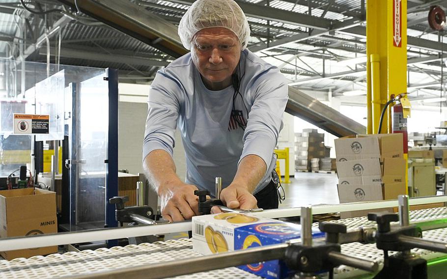 A man working on an assembly line.