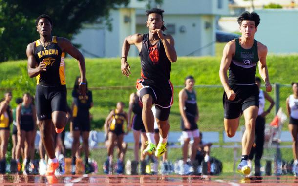OCSI's Jeremiah Tucker, center, now holds the Pacific record in the 100 at 10.45 seconds.