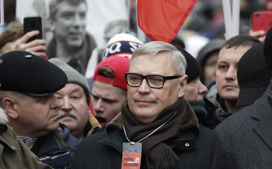 FILE - Former Russian Prime Minister, and one of opposition leaders, Mikhail Kasyanov, center, attends a march in memory of opposition leader Boris Nemtsov in Moscow, Russia, on Feb. 24, 2019. Russia's Justice Ministry on Friday, Nov. 24, 2023, added Mikhail Kasyanov, who was President Vladimir Putin's first prime minister but then became one of his opponents, to its register of “foreign agents.”Russian law allows for figures and organizations receiving money or support from outside the country to be designated as foreign agents, a term whose pejorative connotations could undermine the designee's credibility.  (AP Photo/Pavel Golovkin)