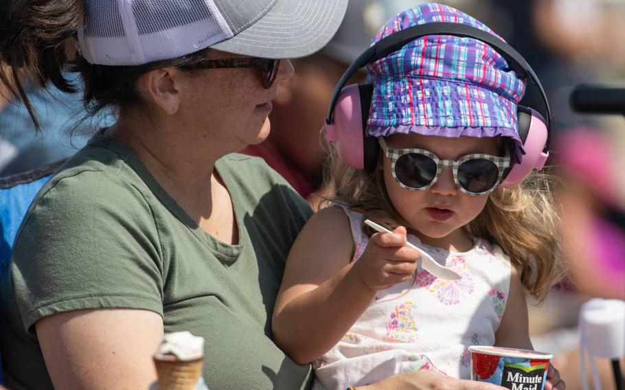 Erica OConnor of Rocklin holds her daughter Emery, 2, while eating frozen lemonade at the California Capital Airshow on Sept. 24, 2023, at Mather Airport.