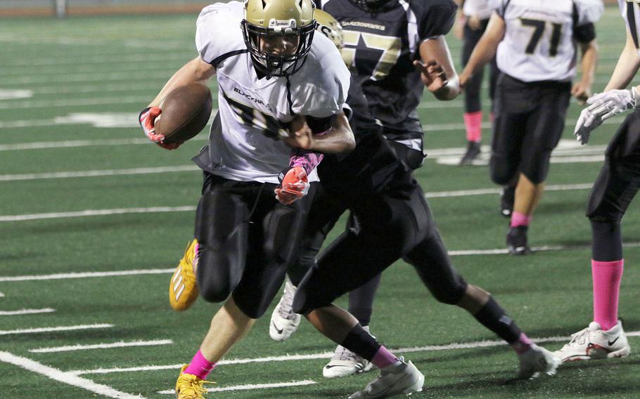 Humphreys Gold's Lucas Bochat is pushed to the sideline by Humphreys Black's Nathaniel Meno.