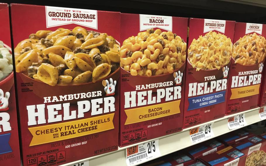 A variety of General Mills Hamburger Helper and Tuna Helper appear on a shelf at a grocery story in Waterbury, Vt. on Dec. 7, 2021. Boxed foods became popular in the 1970s as more women entered the work force. They are relatively cheap, last a long time on shelves. 