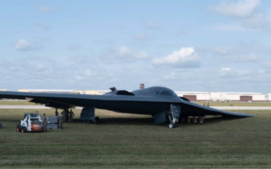 The Spirit of Georgia B-2 bomber after coming to a stop in a grassy area east of the runway at Whiteman Air Force Base, Missouri, Sept. 14, 2021. A mechanical failure caused the left landing gear to collapse, causing the left wing to make contact with the runway and damaging parts of the left side of the aircraft.