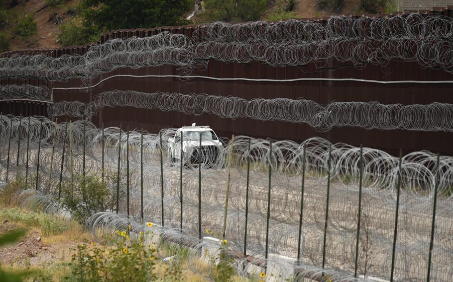 An ICE vehicle passes the border.