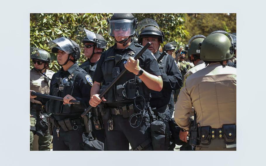 UCLA campus police officers and L.A. County sheriff’s deputies stand guard during the campus protest at UCLA. 