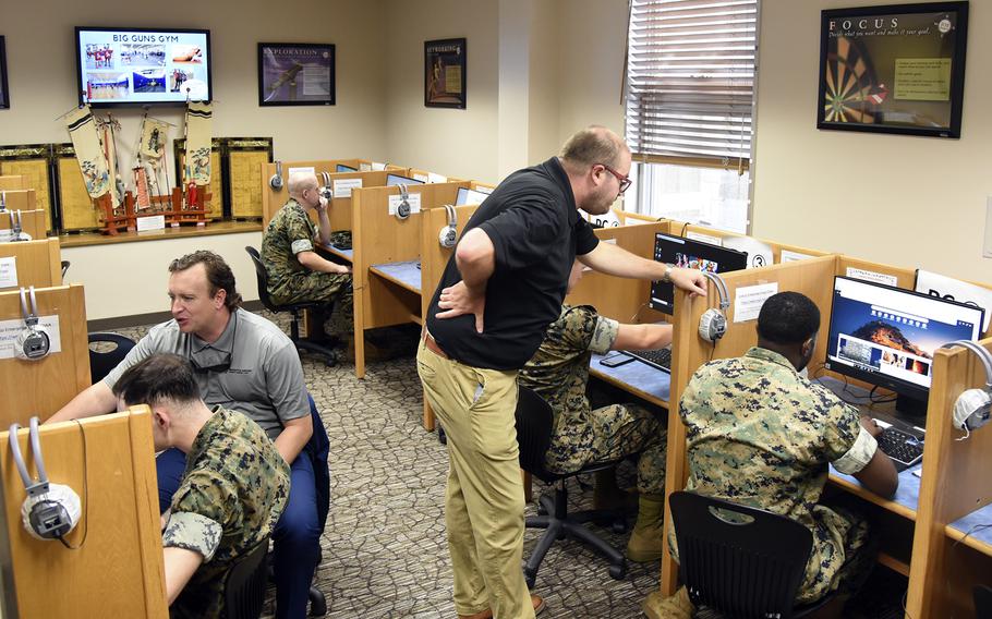 Marines sign up for University of Maryland Global Campus classes at Combined Arms Training Center Camp Fuji, Japan, July 12, 2024. 