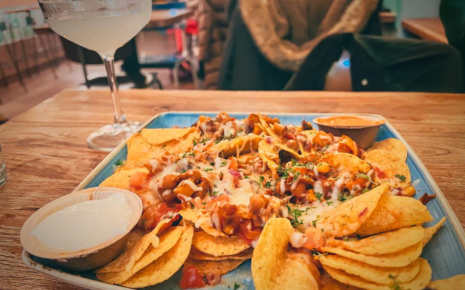 The nacho plate with chili sin carne at El Burro Restaurant and Bar on Nov. 20, 2022,  in Mainz, Germany. The warm corn chips are also offered with black beans, chili or chicken and beef toppings.