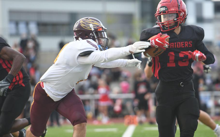 Kaiserslautern's Joseph Rodriquez-Martinez evades a tackle during the Raiders' 33-19 win at home Friday, Sept. 17, 2021, against Vilseck.