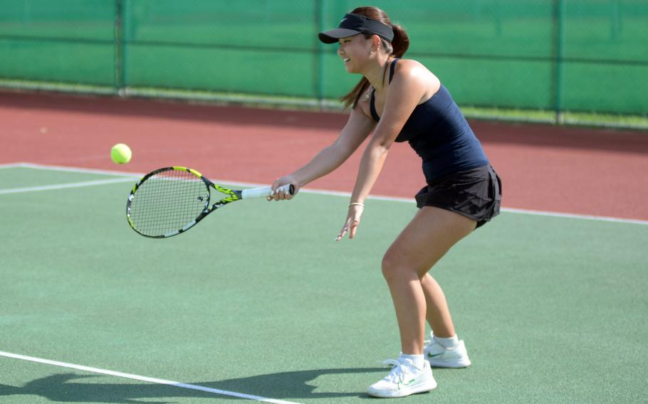 Chloe Lee makes a volley.