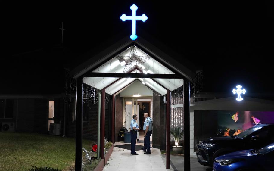 Security officers stand guard outside Orthodox Assyrian church in Sydney on April 15, 2024.