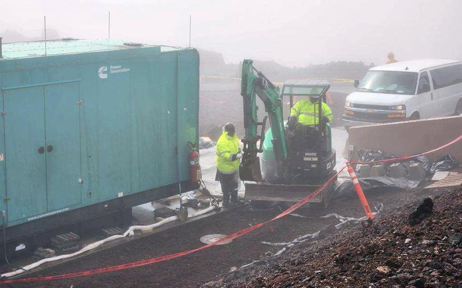 Contractors with the firm U.S. Ecology dig up earth contaminated with diesel fuel at the Maui Space Surveillance Complex in Maui, Hawaii, March 3, 2023. 