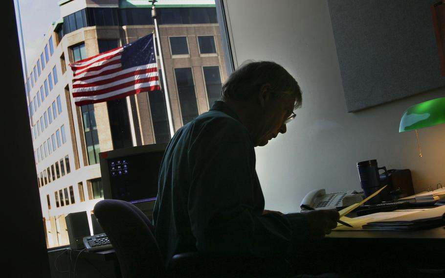 Edwards in his office at NPR in Washington in February 2004.