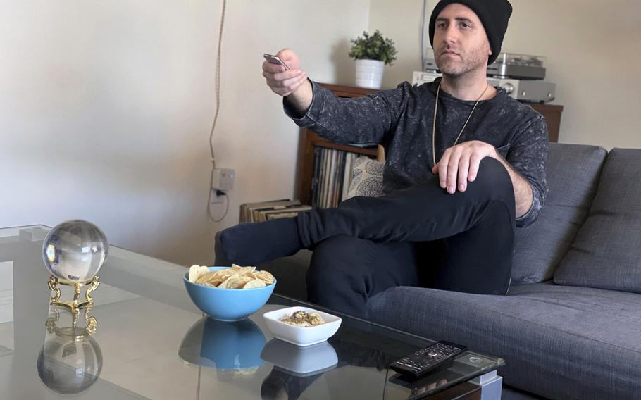Chandler Sterling watches television on Feb. 4 in Los Angeles. In this age of intense cybersecurity and calls for multi-factor lockdown of all things digital, Sterling uses a former girlfriend’s logins for two streaming services. 