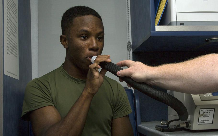 A lance corporal takes a Breathalyzer test at Camp Lejeune, N.C., Sept. 29, 2017.