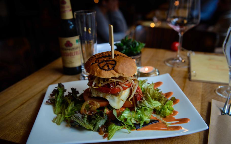 The “mountain climber” burger at DieDa im Weingut in Bad Duerkheim, Germany, comes loaded with red pepper, onions and sprouts.